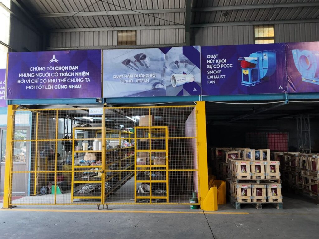 Industrial workspace featuring machinery and organized storage area.