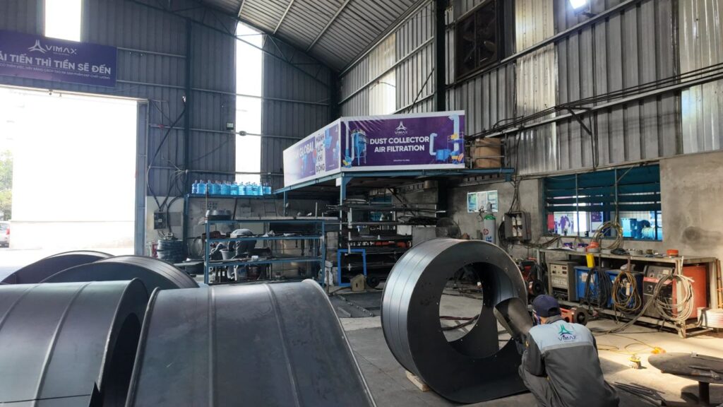 Industrial workshop with machinery and air filtration equipment.